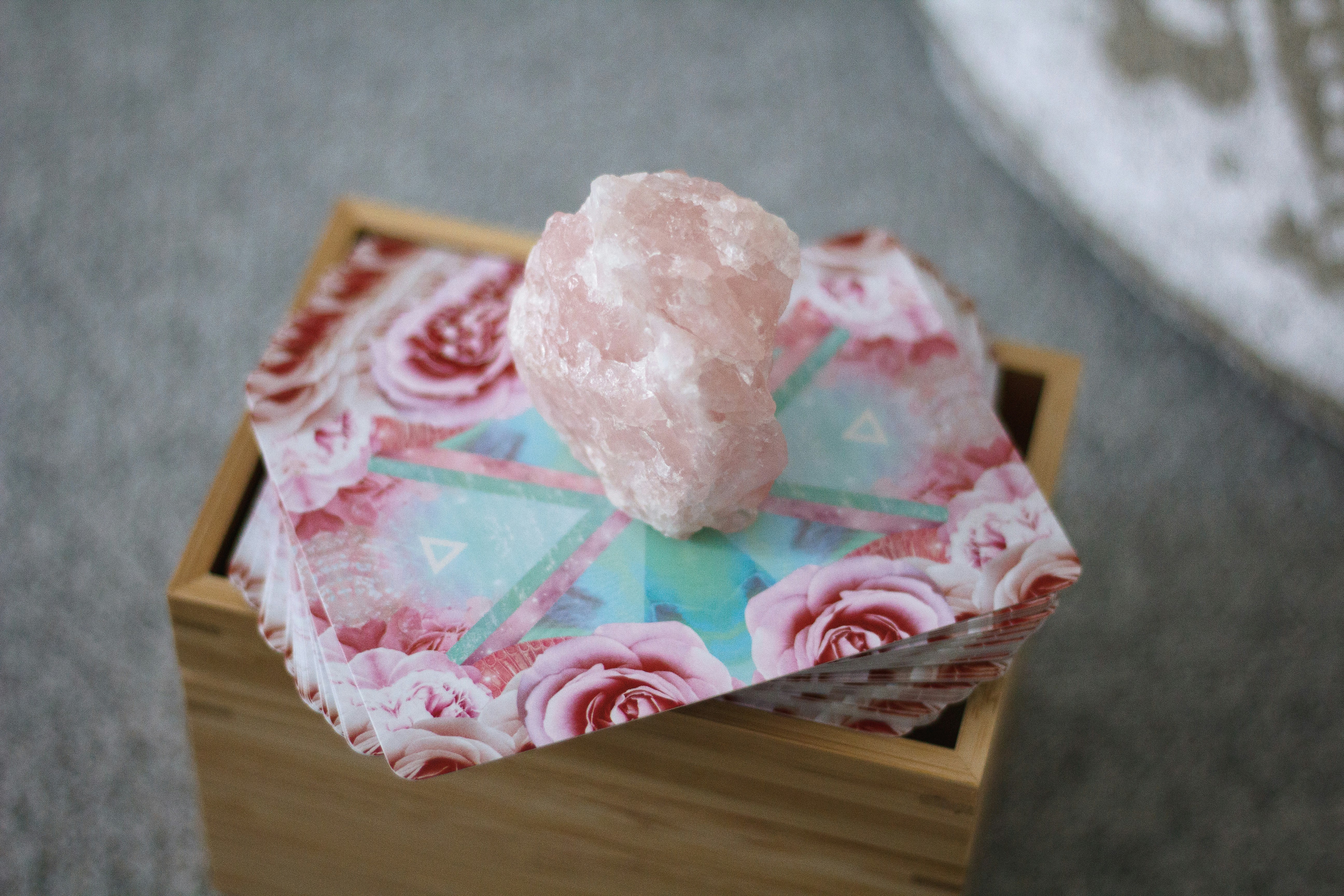 pink and white heart shaped cake on brown wooden table